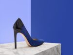 Regin attracts the eye with an elegant spectator back detail. In striking cobalt blue kid suede featuring a black patent back quarter and heel. This striking pump is a wardrobe essential.